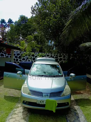 Photo - Nissan Tiida 1.5L DCI 6MT 2007 Gray