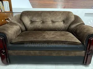 This Is a Brown and Black Fabric Priyesta Sofa Set