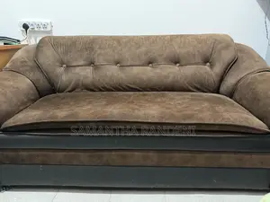 This Is a Brown and Black Fabric Priyesta Sofa Set