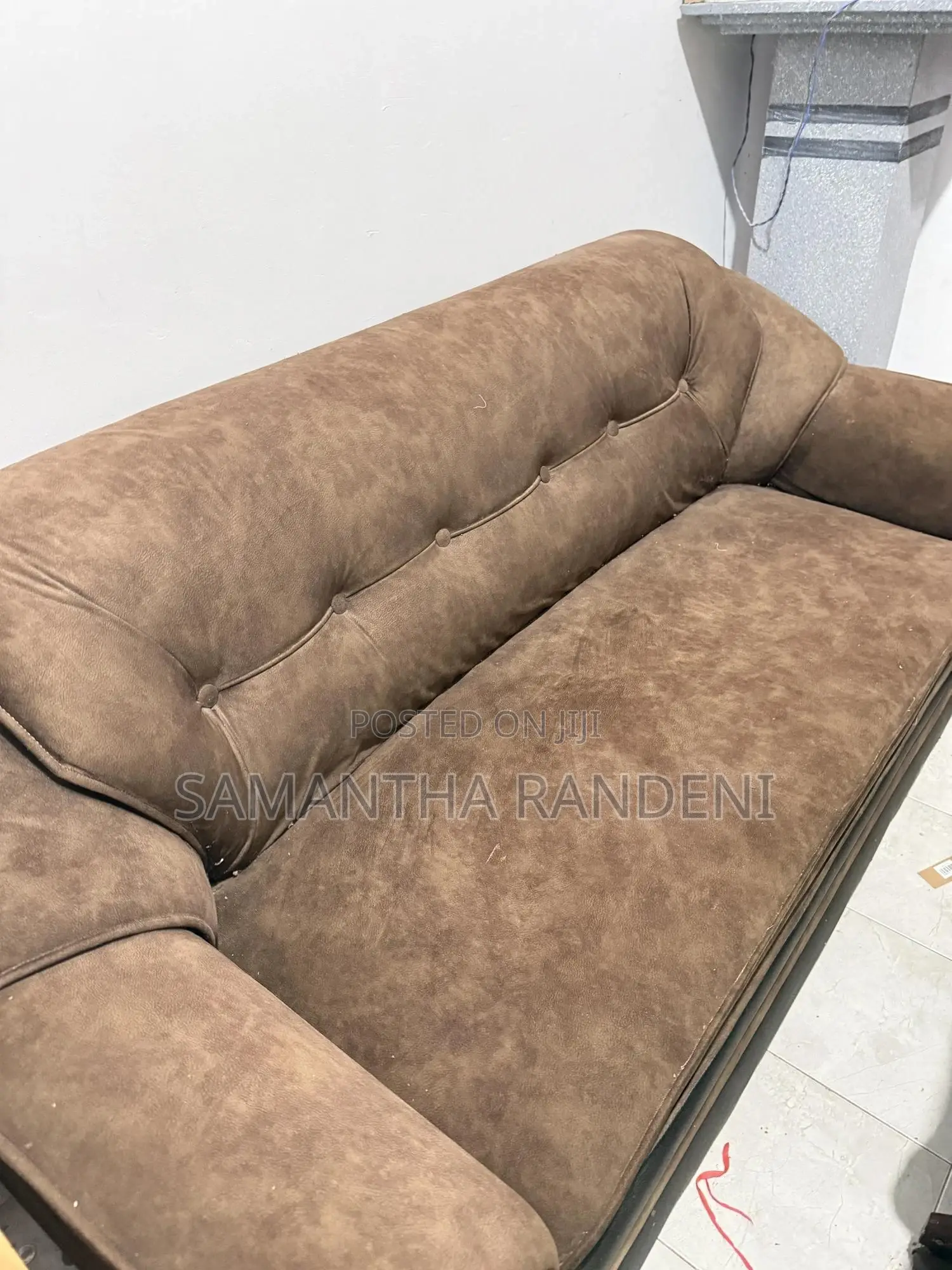 This Is a Brown and Black Fabric Priyesta Sofa Set