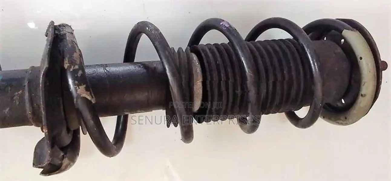 Nissan Note E12 Front Shock L/h