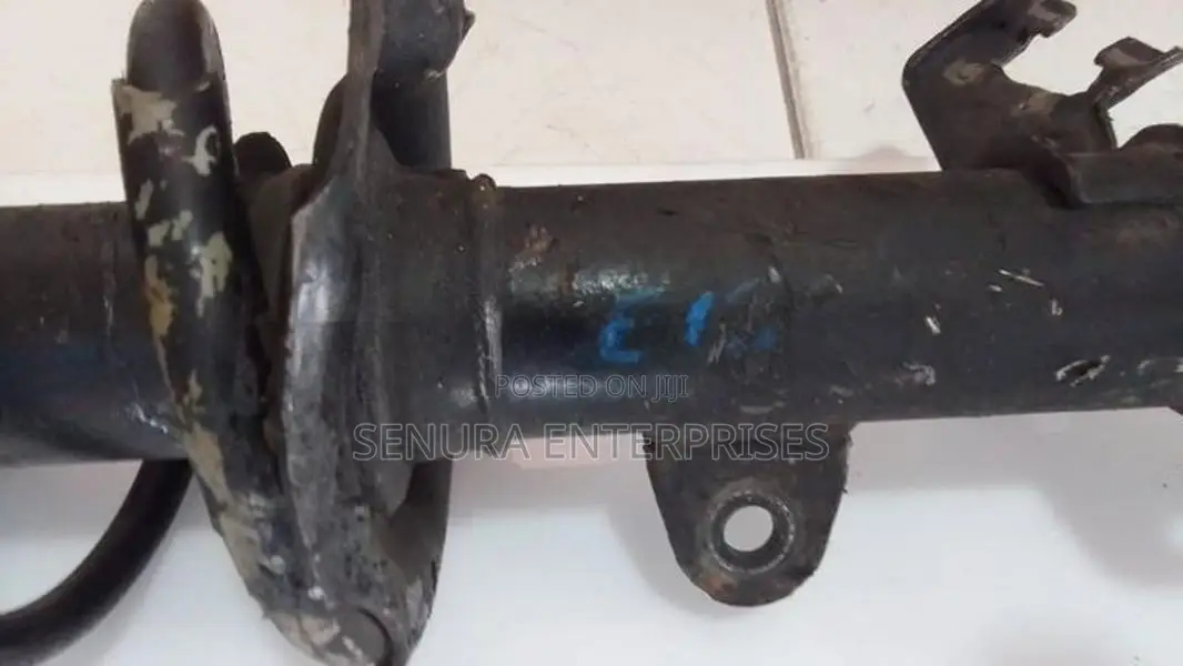 Nissan Note E12 Front Shock L/h