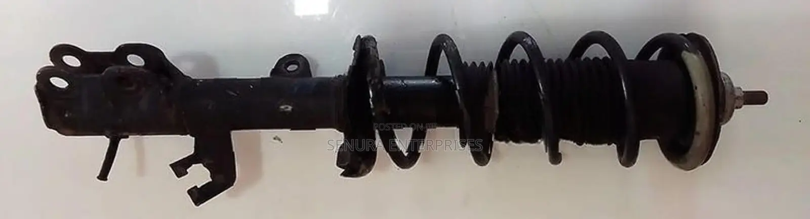 Nissan Note E12 Front Shock L/h