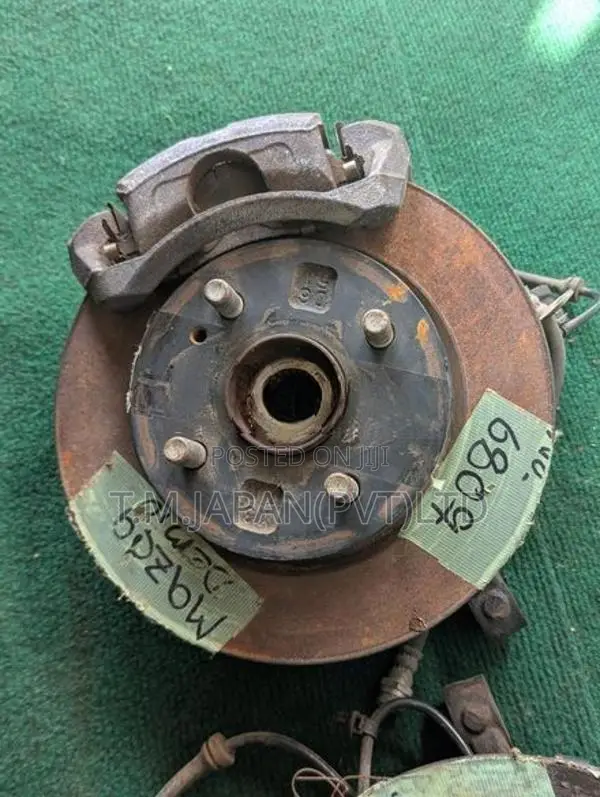 MAZDA DEMIO WHEEL HUB WITH BRAKE CALIPER