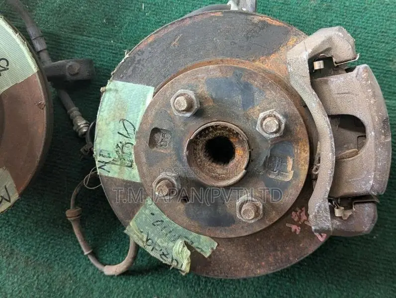 MAZDA DEMIO WHEEL HUB WITH BRAKE CALIPER