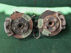 MAZDA DEMIO WHEEL HUB WITH BRAKE CALIPER