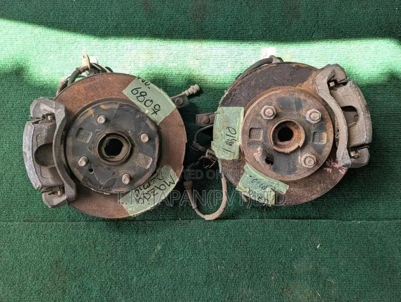 MAZDA DEMIO WHEEL HUB WITH BRAKE CALIPER