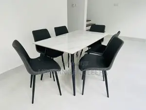 granite dining table with cushion chairs