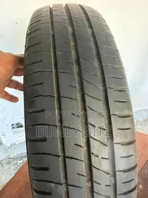 Nissan Alloy Wheels with Dunlop Tires (155/65R14)