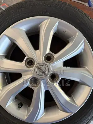 Nissan Alloy Wheels with Dunlop Tires (155/65R14)