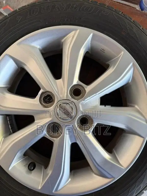 Nissan Alloy Wheels with Dunlop Tires (155/65R14)