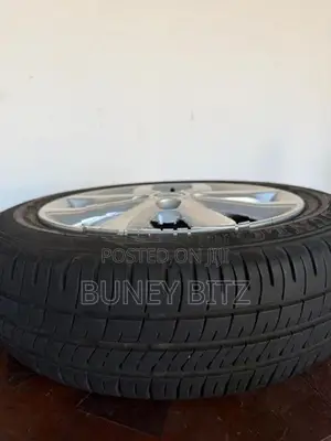 Nissan Alloy Wheels with Dunlop Tires (155/65R14)