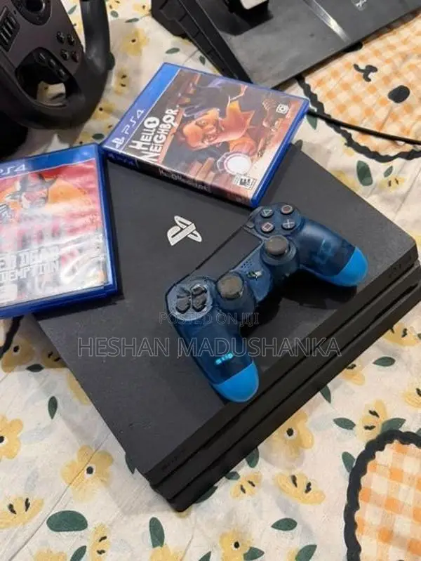 PS4 Pro 1TB + Racing Wheel with Consoles