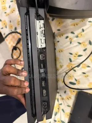 PS4 Pro 1TB + Racing Wheel with Consoles