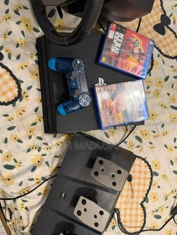 PS4 Pro 1TB + Racing Wheel with Consoles