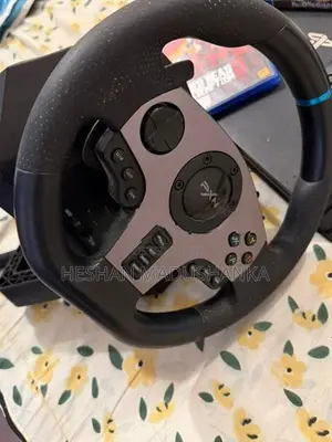 PS4 Pro 1TB + Racing Wheel with Consoles