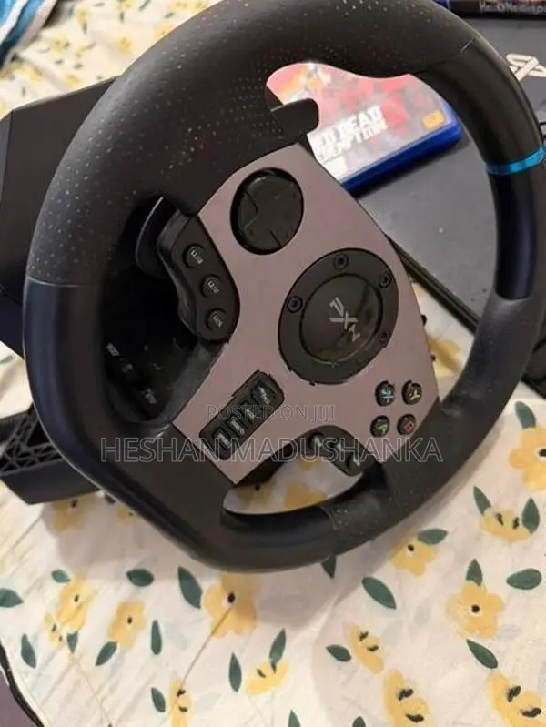 PS4 Pro 1TB + Racing Wheel with Consoles