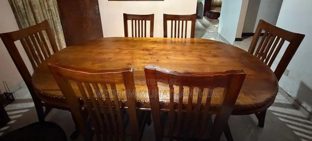 Selling a solid teak wood 6-seater dining table set.
