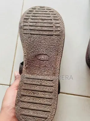 A Brown Color Pair of School Shoes