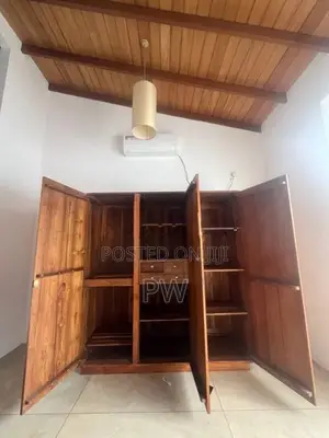 Three door teak wardrobe