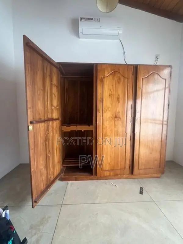 Three door teak wardrobe