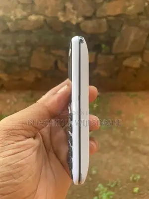 Liam Button Phone (Used)