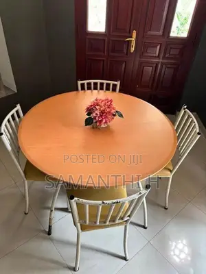 A Steel Table with 4 Cushion Chairs