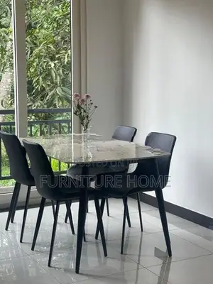 granite dining table with cushion chairs