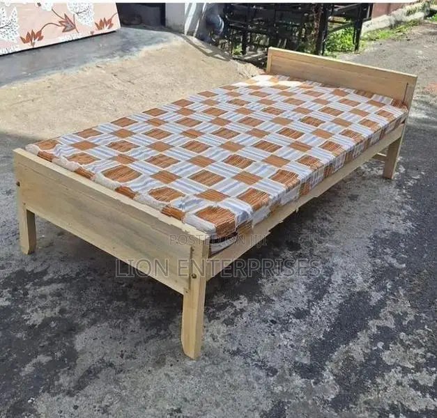 Wooden bed with mattress