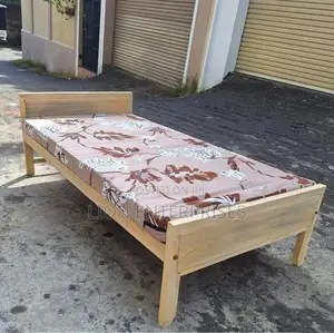 Wooden bed with mattress