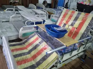 Four-Function Manual Bed with Lateral Tilt and Sanitary Functionality