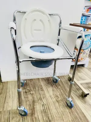 Commode chair with wheel