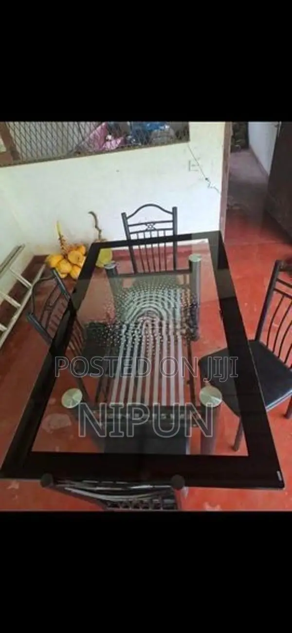 Glass table with four chairs