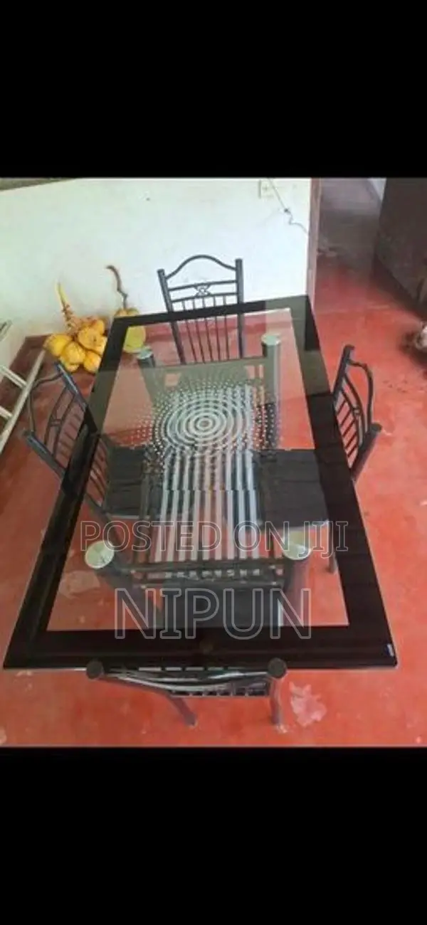 Glass table with four chairs