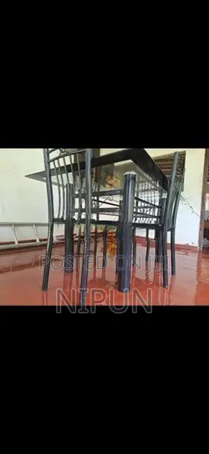 Glass table with four chairs