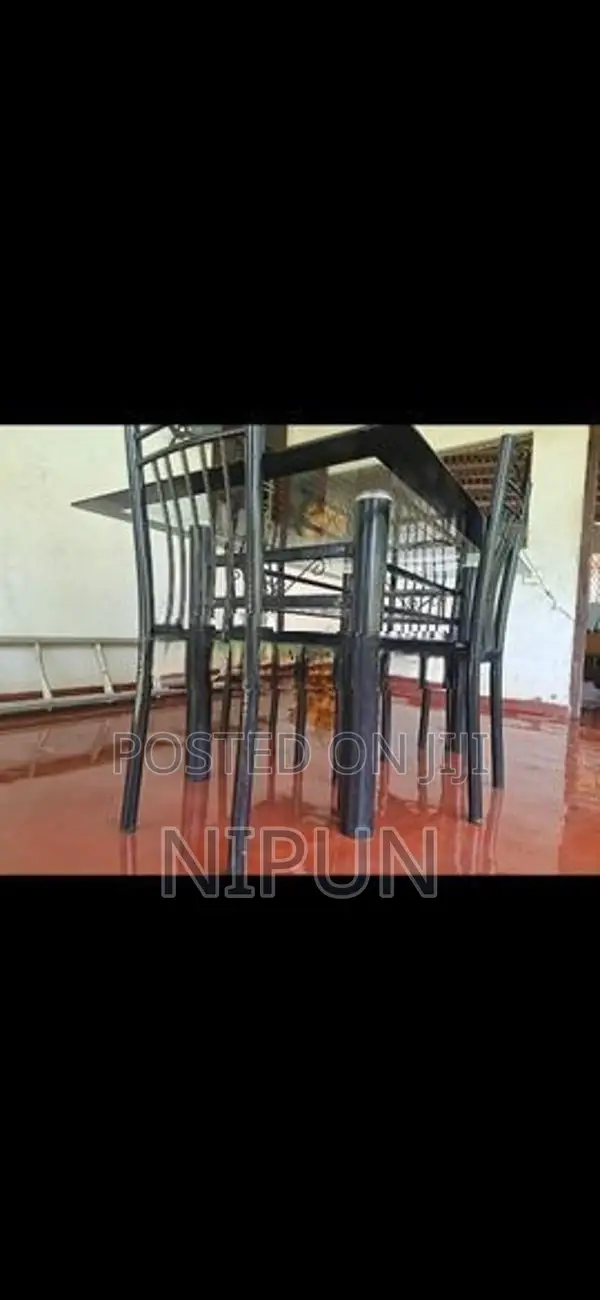 Glass table with four chairs