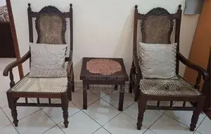 Used 3 cane chairs with coffee table
