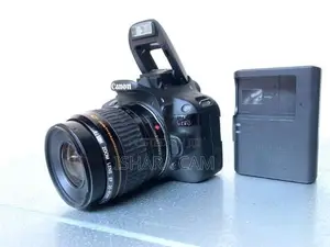 canon 100D DSLR body with lens