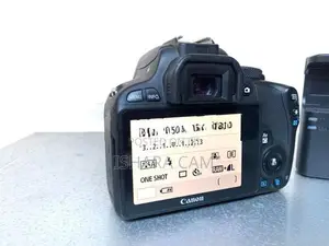 canon 100D DSLR body with lens