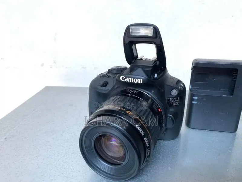 canon 100D DSLR body with lens