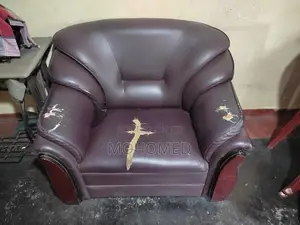 This dark brown 3-seater PVC sofa