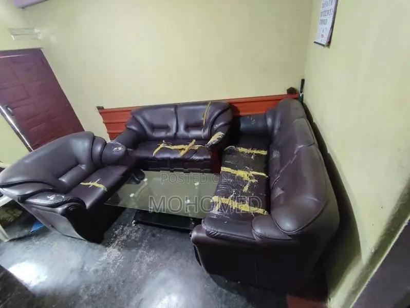This dark brown 3-seater PVC sofa