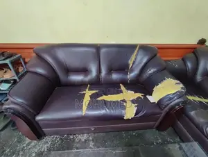 This dark brown 3-seater PVC sofa