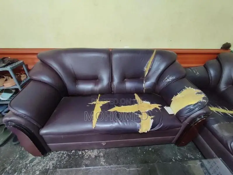 This dark brown 3-seater PVC sofa