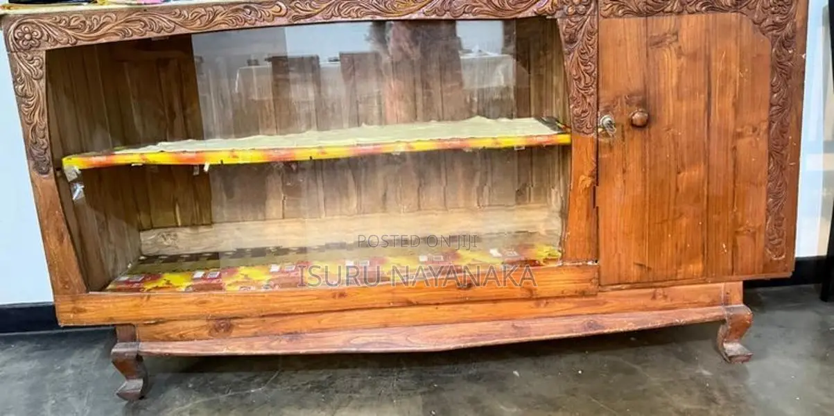 Elegant Carved Wooden Display Cabinet with Glass Sliding Doors