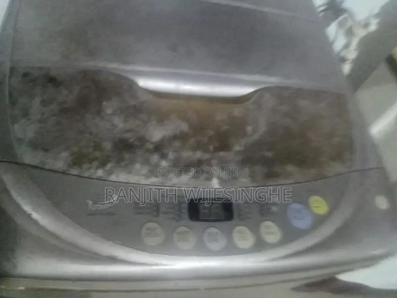 LG FULL AUTO TOP LODING W/MACHINE