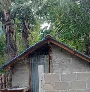 Land with small house for sale