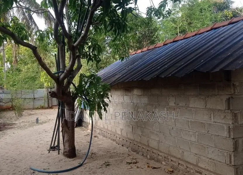 Land with small house for sale
