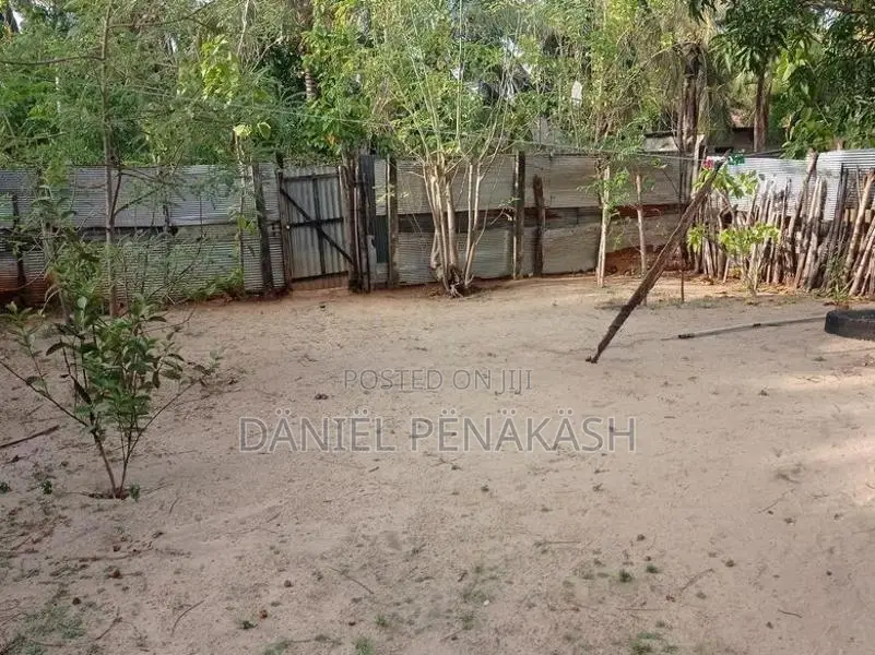 Land with small house for sale