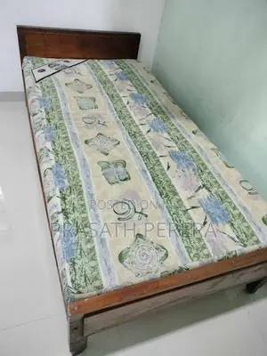 One Used Wooden Bed